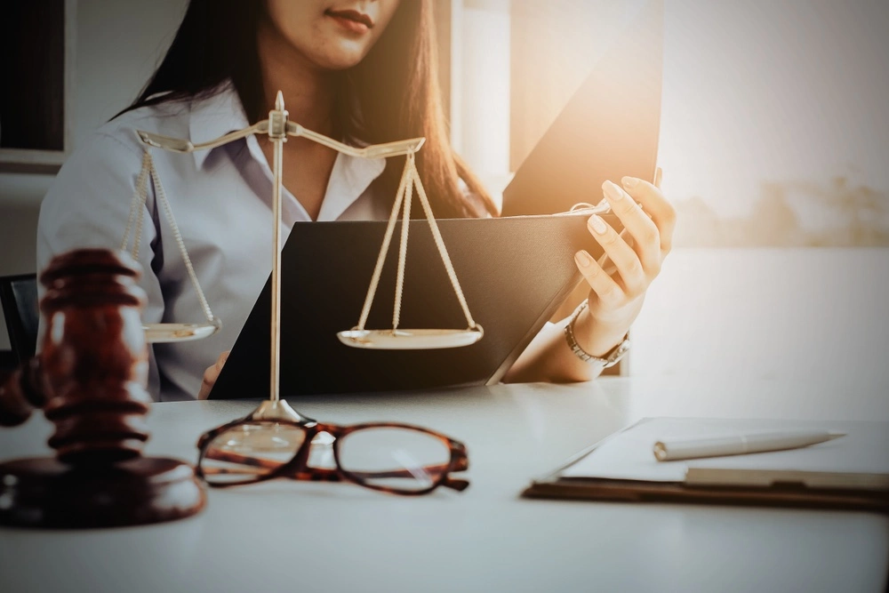 Brownsville rideshare accident lawyer reviewing case documents, illustrating Texas rideshare insurance laws and how they impact accident claims.