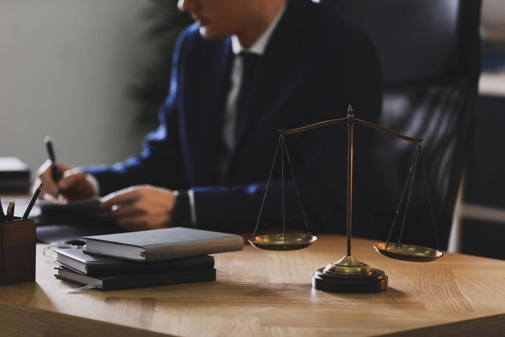Catastrophic injury lawyer working in a Brownsville office, illustrating the urgency and immediate legal action required after a serious injury.