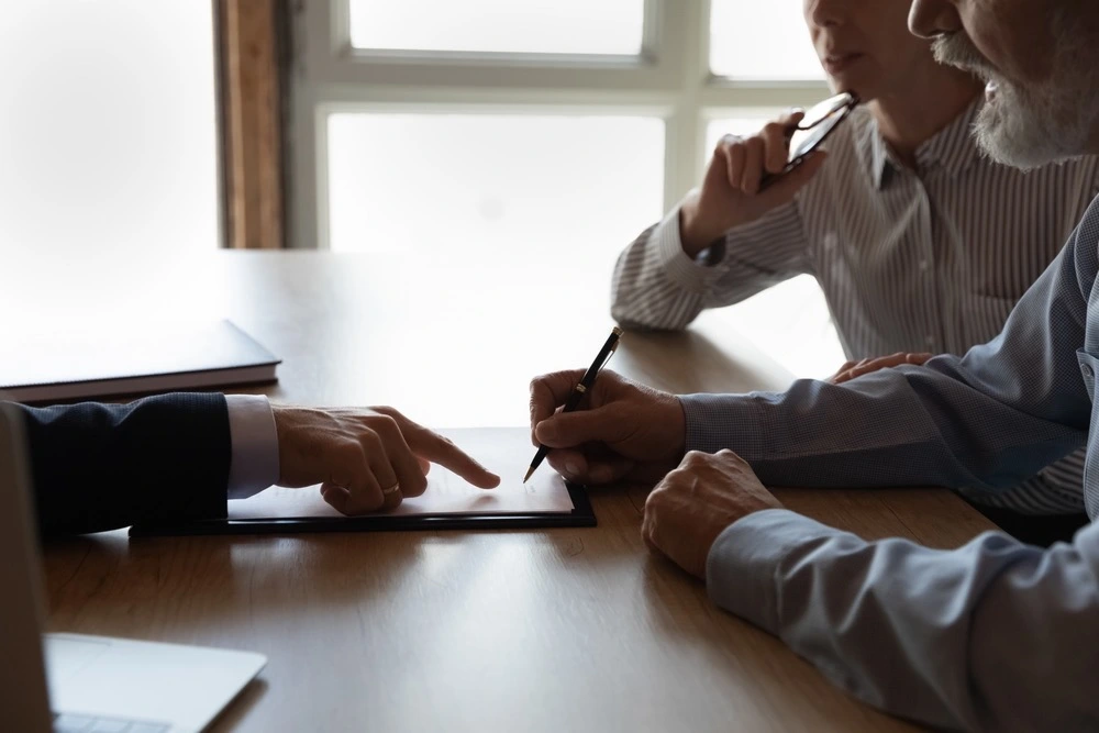 Client consulting with a slip and fall lawyer, illustrating the process of proving negligence in a Brownsville slip and fall case.