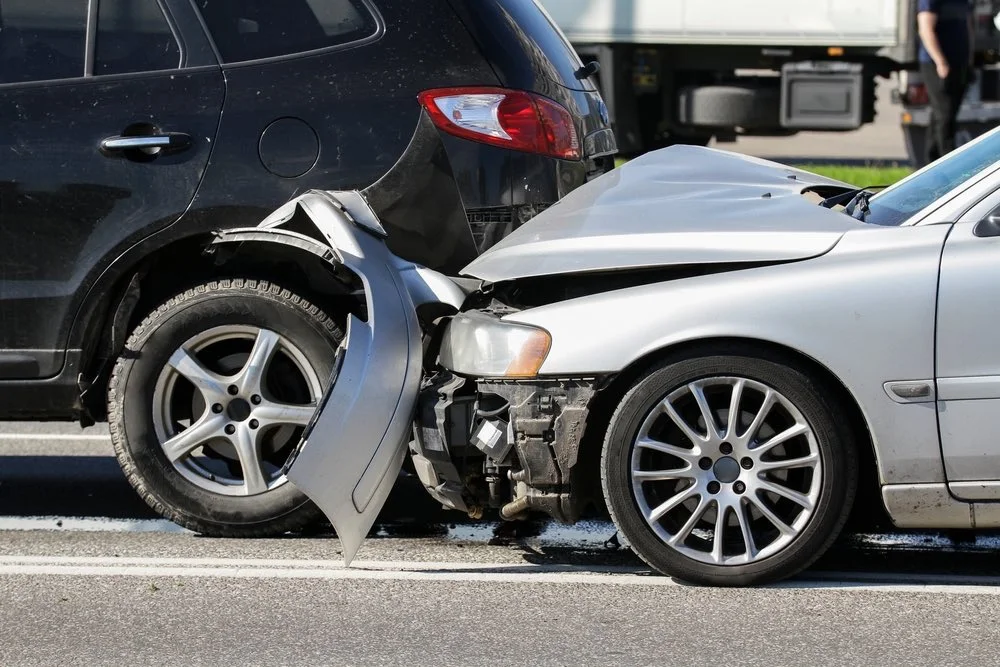 Car accident scene on a busy Houston roadway, illustrating common rideshare accident scenarios in the city.
