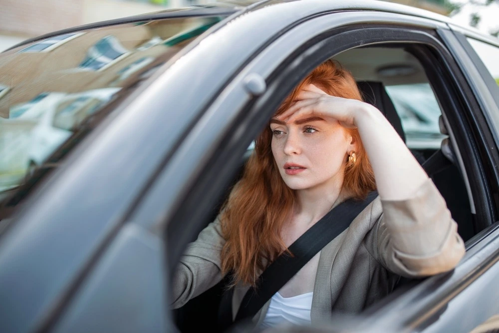 Driver seated behind the wheel of a car, illustrating how rideshare insurance works in Houston accident cases.
