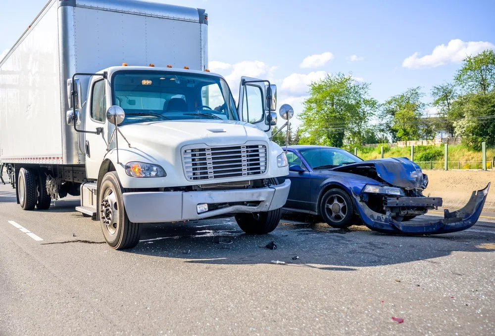 Truck accident scene on a roadway, illustrating how Harlingen truck accidents differ from typical car crashes in severity and complexity.