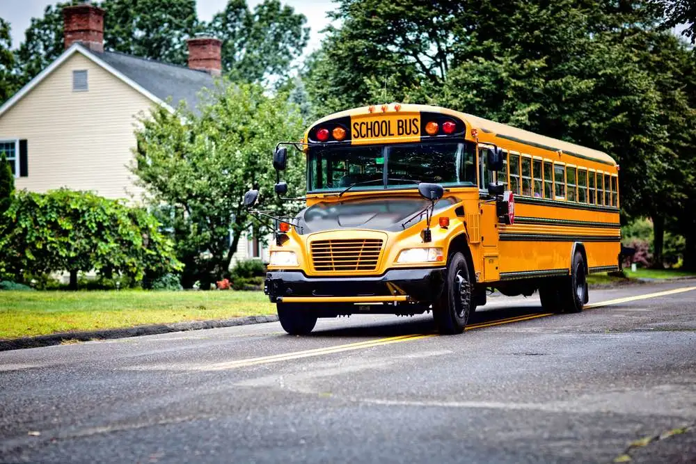School bus traveling on a roadway, illustrating bus accidents in McAllen and across Hidalgo County.