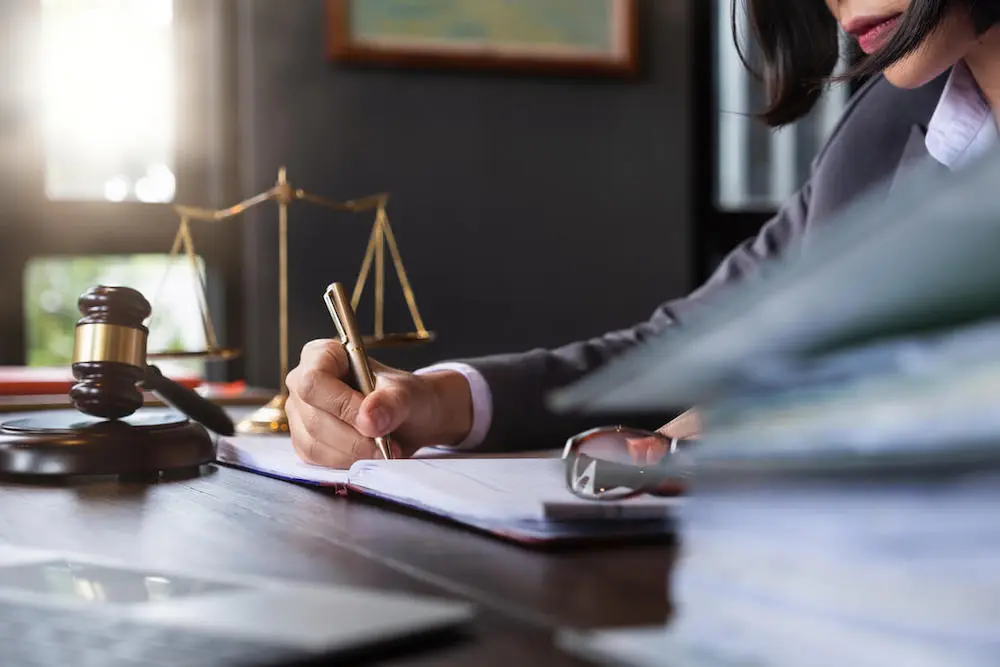 McAllen burn injury lawyer working in an office while reviewing case files, highlighting why clients trust Kenny Perez Law for dedicated representation in burn injury cases.