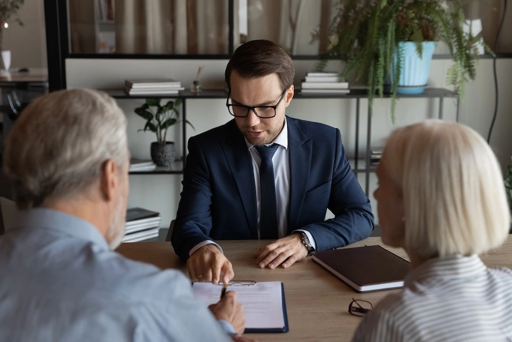 Clients consulting with a personal injury lawyer in an office setting, representing Los Fresnos accident victims choosing Kenny Perez Law for trusted legal guidance and support.