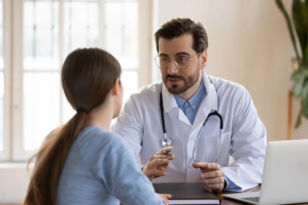 Person consulting with a doctor during a medical examination, representing common types of personal injury cases on South Padre Island.