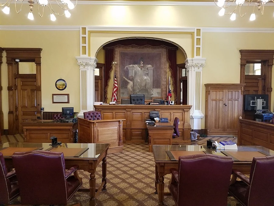 Courtroom setting with a judge’s bench, illustrating Texas laws that affect US-77 accident claims.